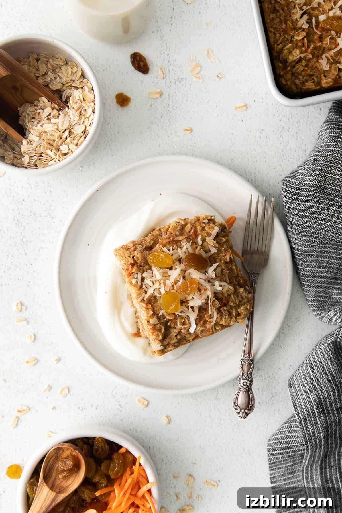 Slice of Morning Glory Baked Oatmeal slice of morning glory baked oatmeal on a plate with a fork