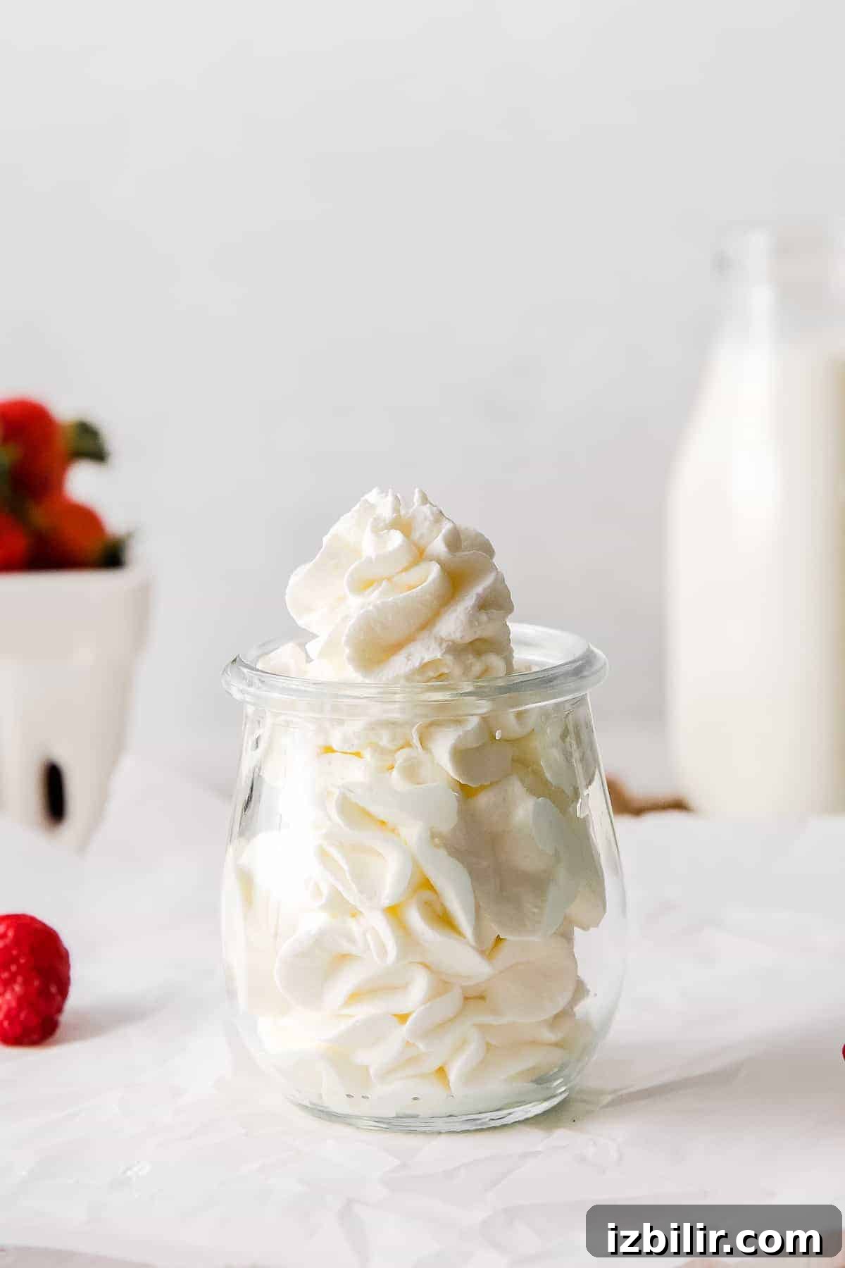 Homemade whipped cream in a small jar.