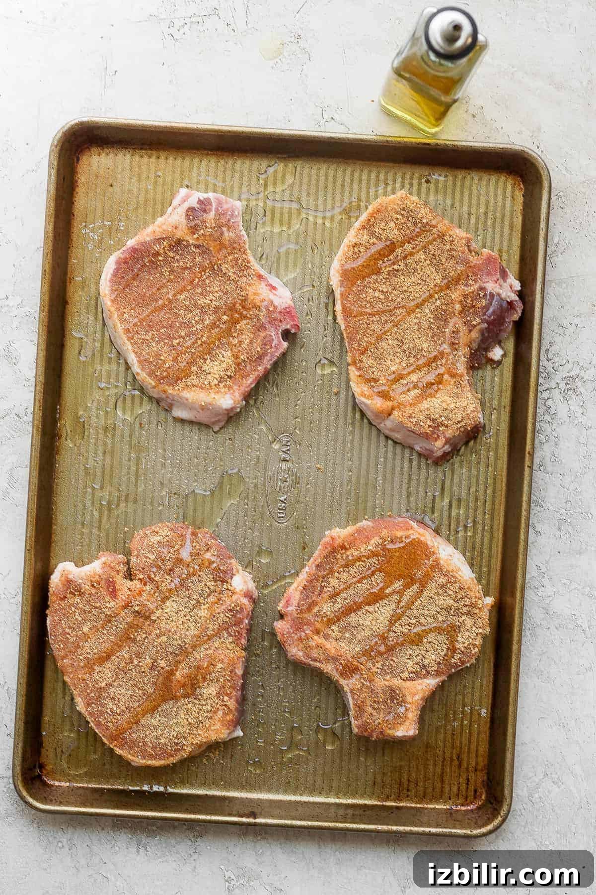 pork chops on baking sheet