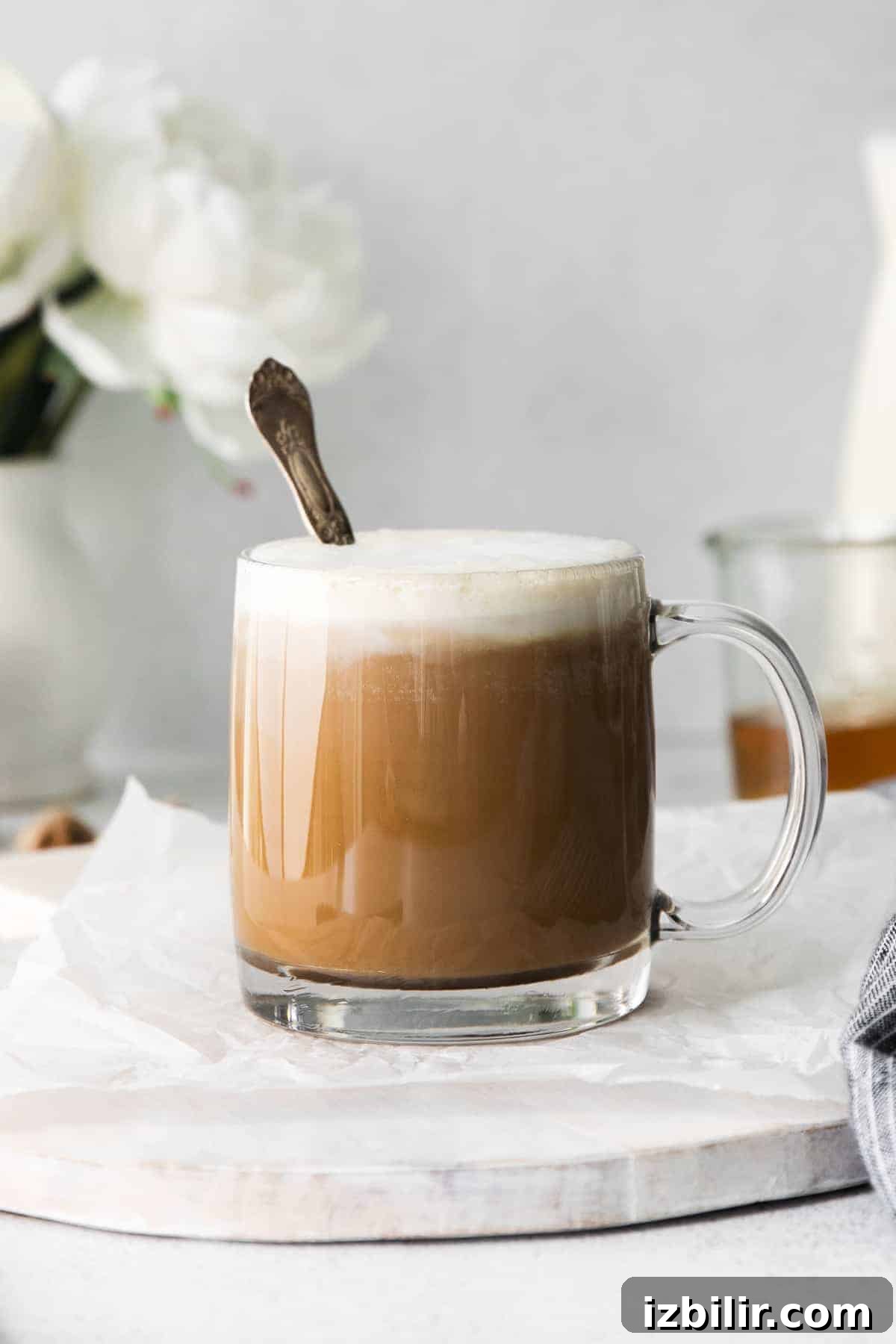 Miel in a coffee mug miel latte in a coffee mug with a spoon