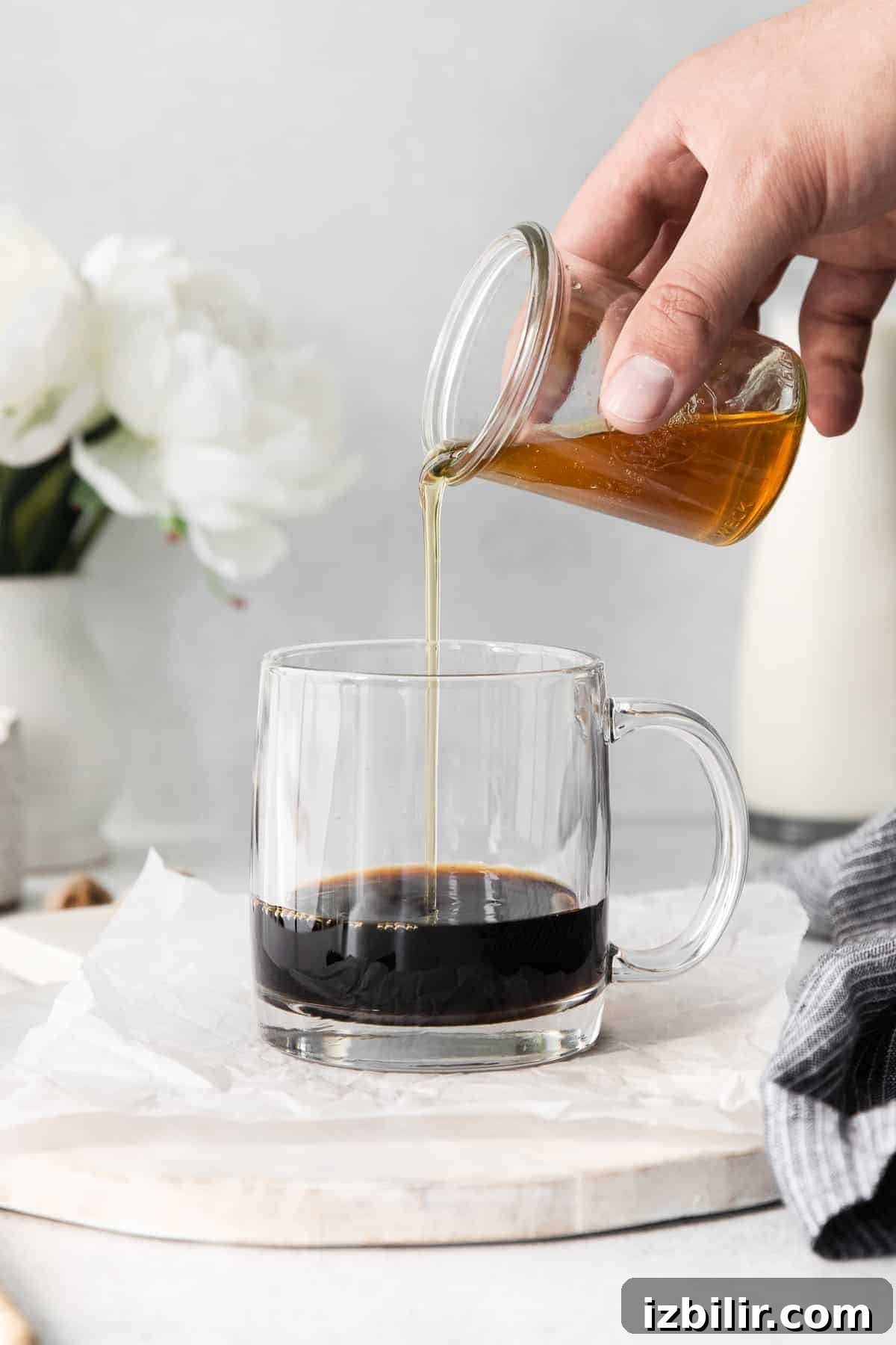 Espresso with honey simple syrup espresso with honey simple syrup being poured