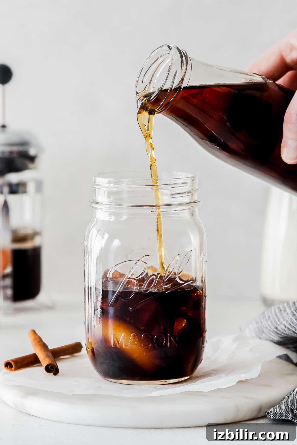 pouring espresso into glass