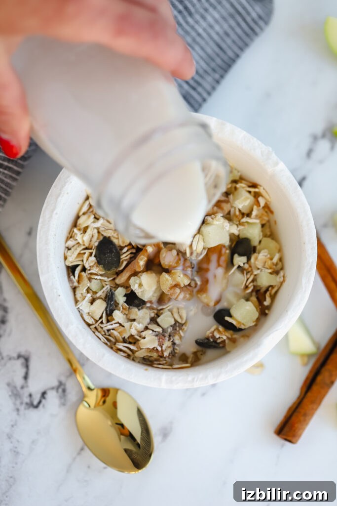 Daily Harvest oat bowl with milk milk being poured over an oat bowl