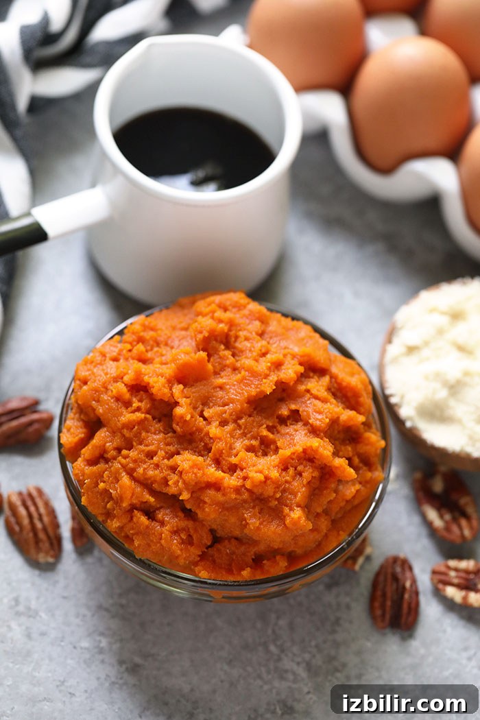 Pumpkin puree ready to be mixed into pancake batter. Pumpkin puree in a bowl ready to be mixed into pancake batter.
