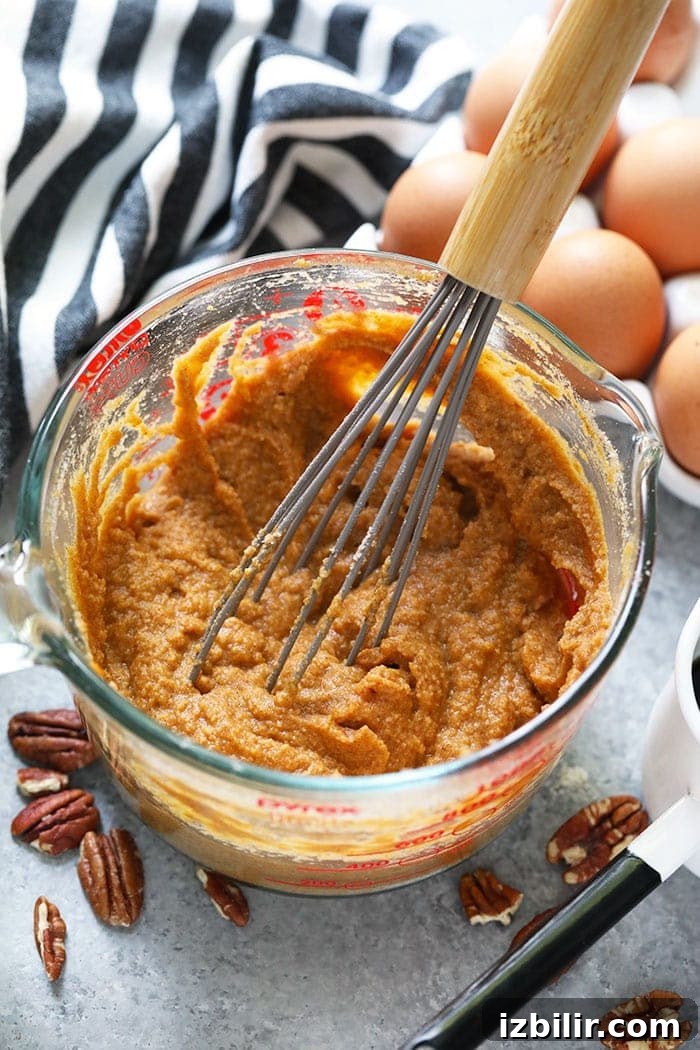 Pumpkin pancake batter Pumpkin pancake batter in a bowl being whisked.