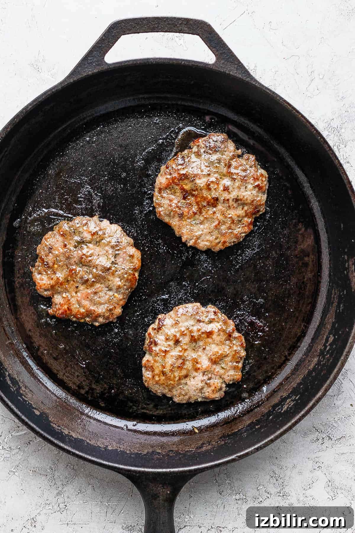 Cooking on cast iron cooking sausage on cast iron skillet