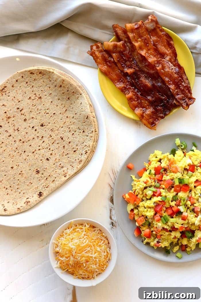 Assembling breakfast burritos with eggs, bacon, and cheese.