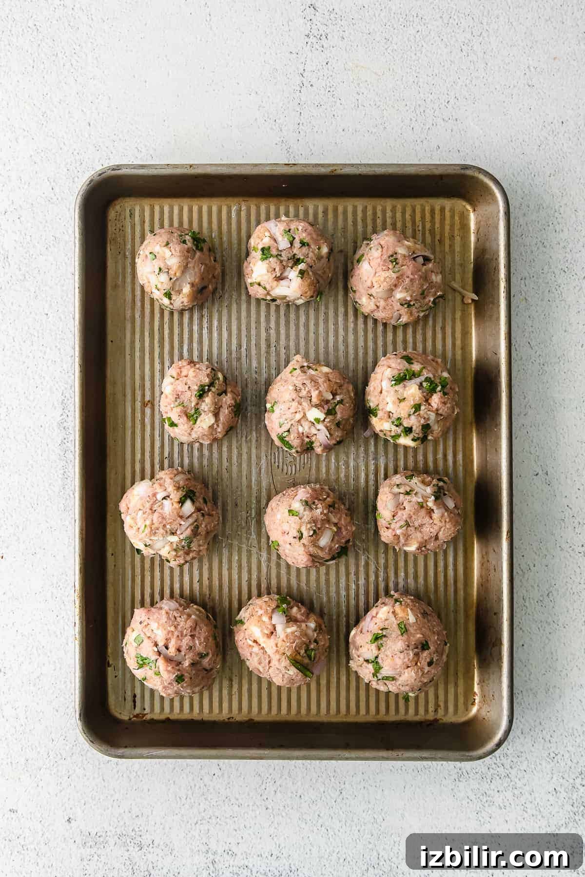 Ground Turkey Meatballs: Juicy, Flavorful Recipe 4 Formed turkey meatballs on a baking sheet
