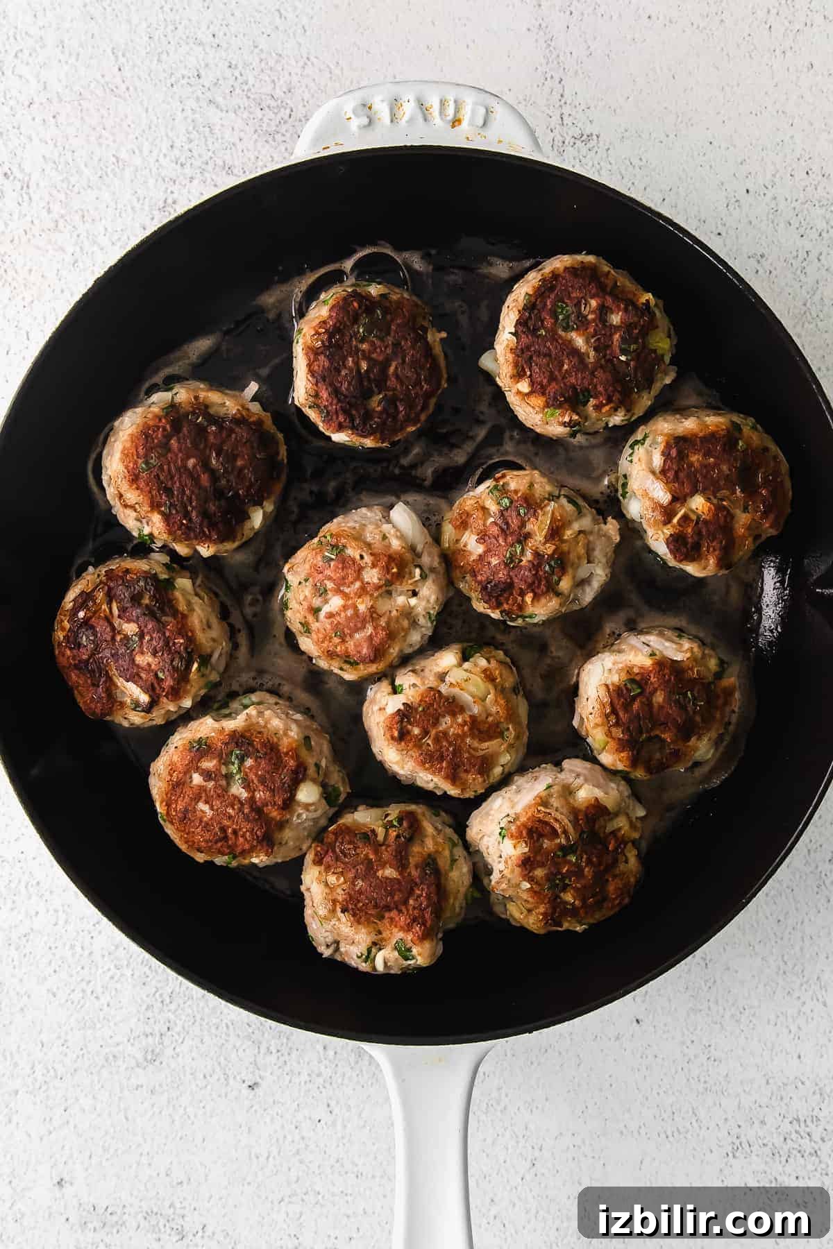 Ground Turkey Meatballs: Juicy, Flavorful Recipe 5 Meatballs simmering in tomato sauce