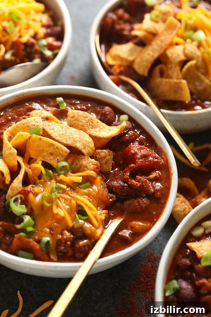 Bowl of beef chili with chips and cheese bowl of beef chili with Fritos and shredded cheese