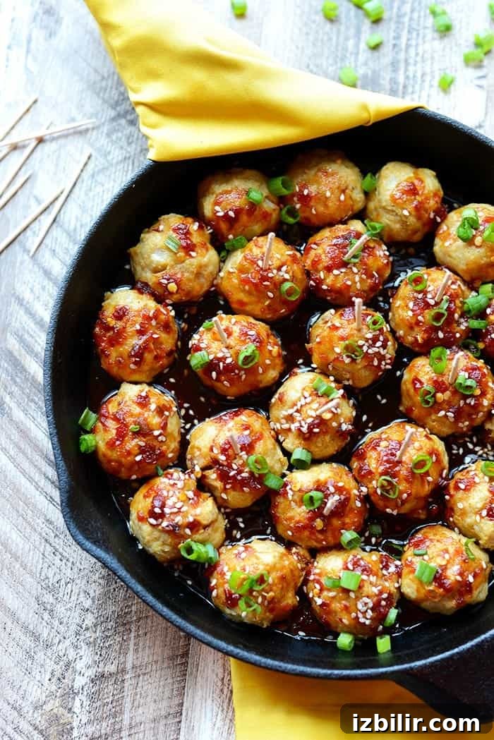 Healthy Baked Chicken Meatballs coated in kung pao sauce Healthy Baked Chicken Meatballs