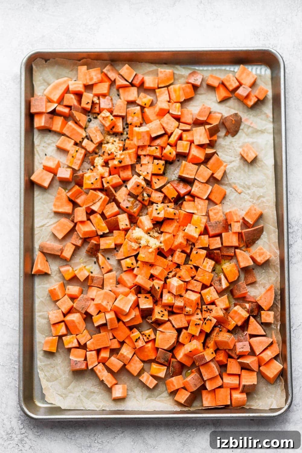 Roasted sweet potatoes on a baking sheet roasted sweet potato on pan