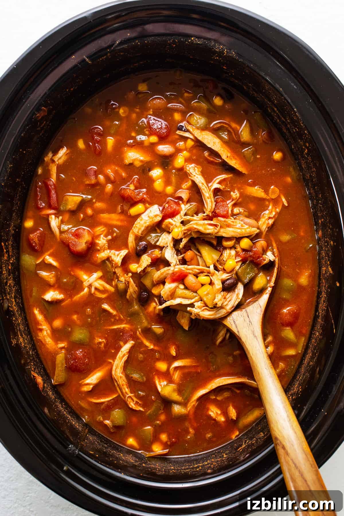 Crockpot Chicken Enchilada Soup Recipe 5 Bowl of slow cooker chicken enchilada soup topped with cilantro