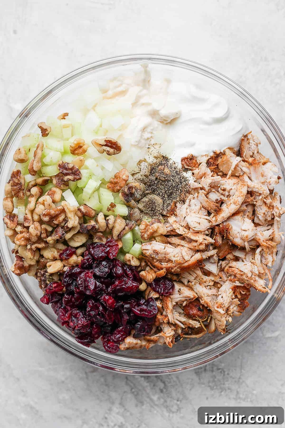 A bowl of turkey salad ingredients.