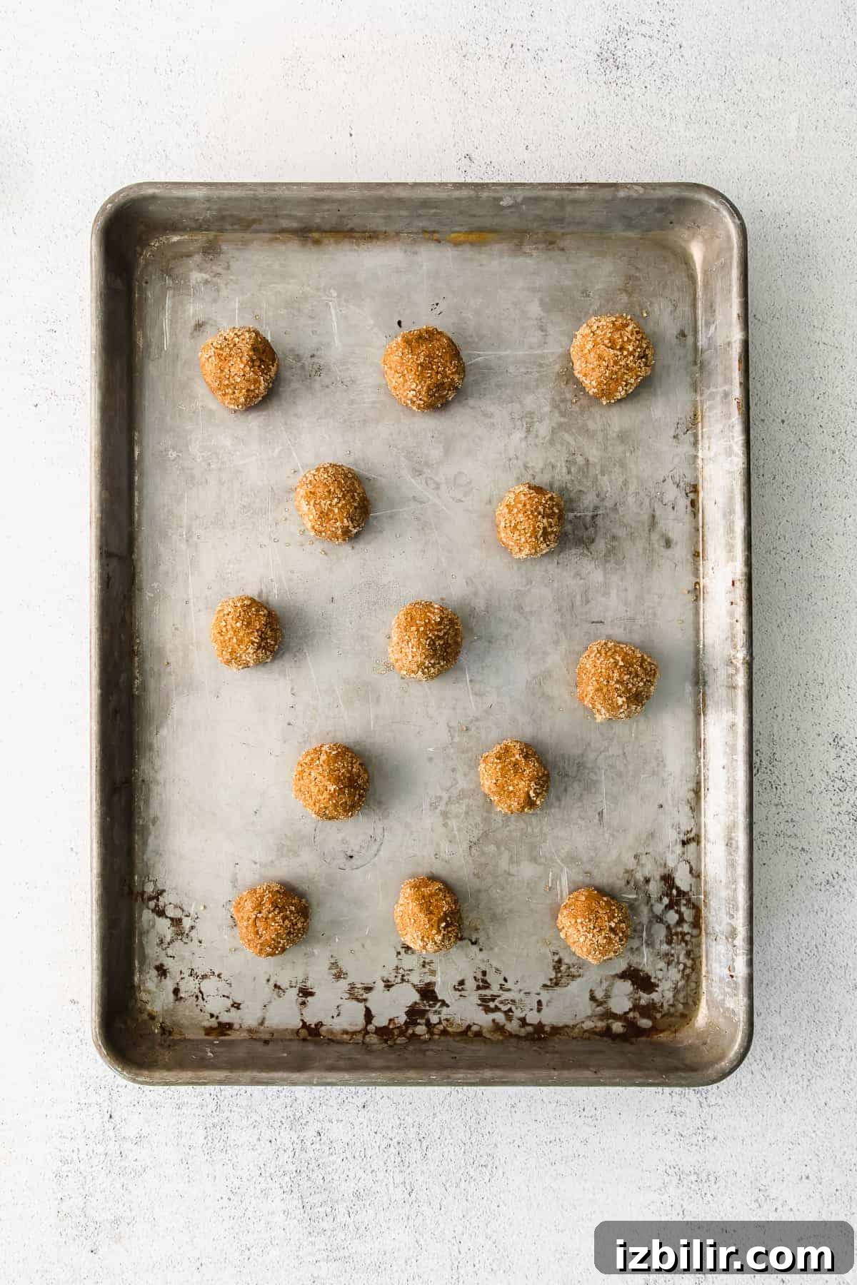 Ginger Molasses Whoopie Pies Recipe with Cream Cheese Filling 5 Ginger whoopie pies rolled on a baking sheet.