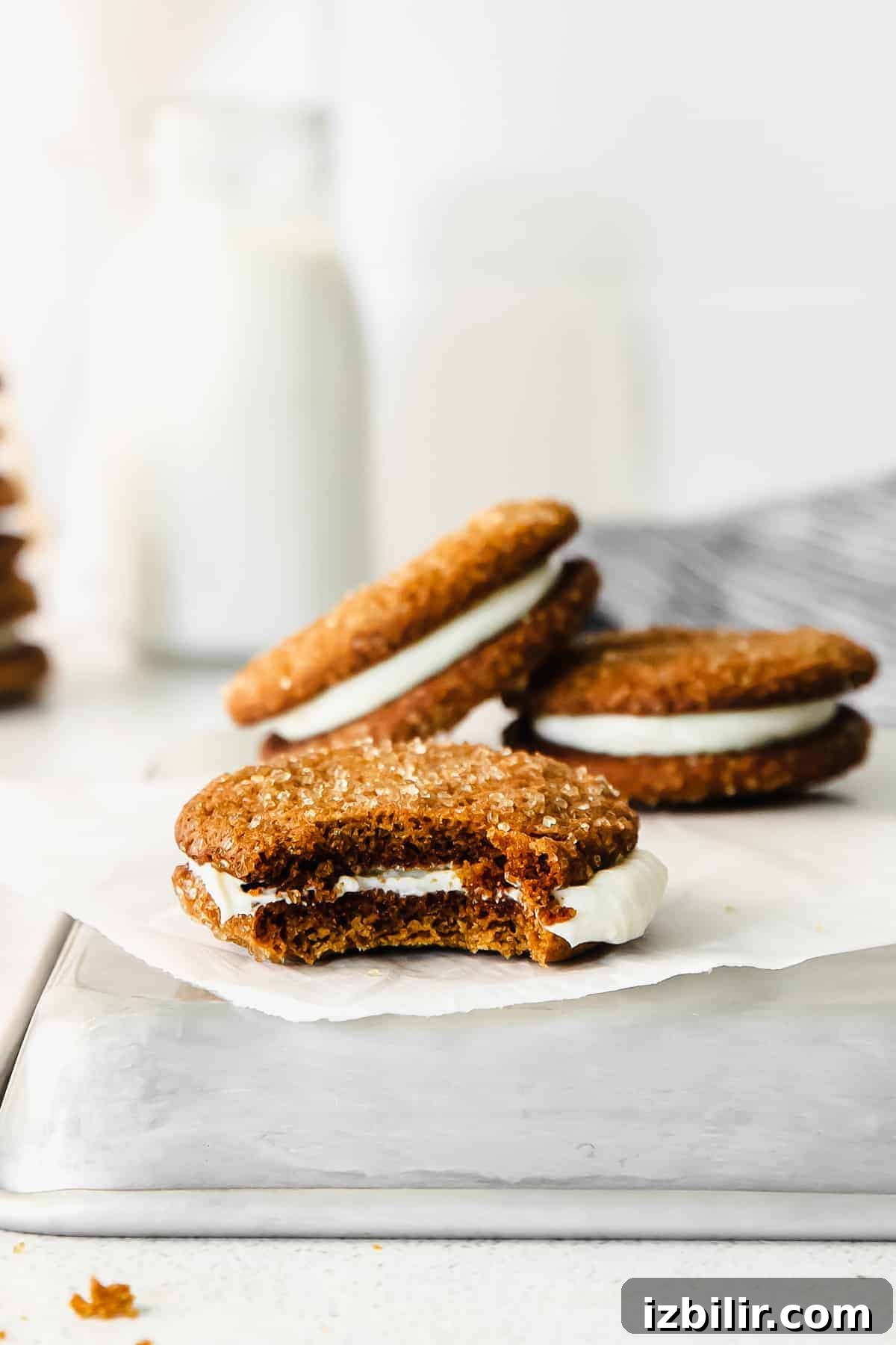 Ginger Molasses Whoopie Pies Recipe with Cream Cheese Filling 8 A whoopie pie with a bite taken out of it.