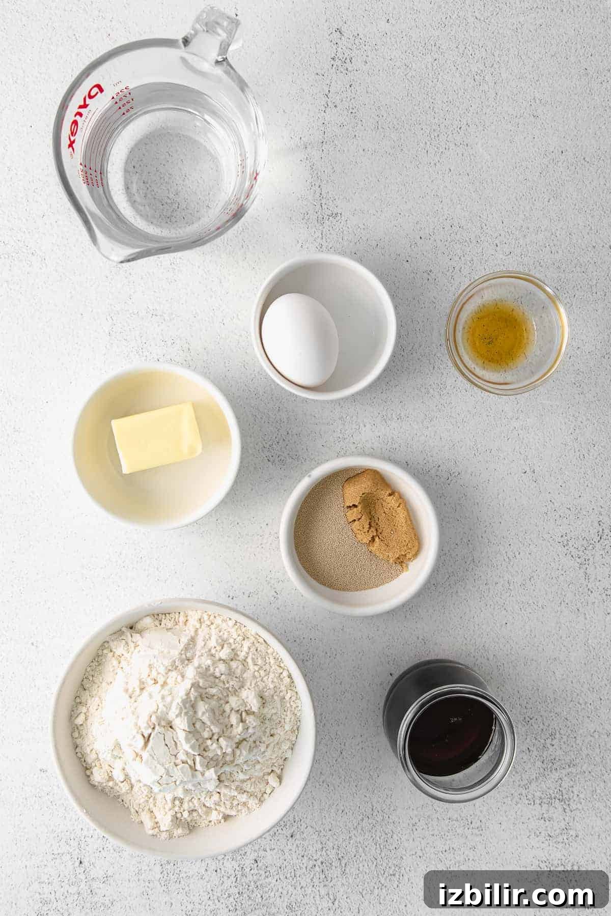 ingredients for maple cinnamon rolls in small bowls