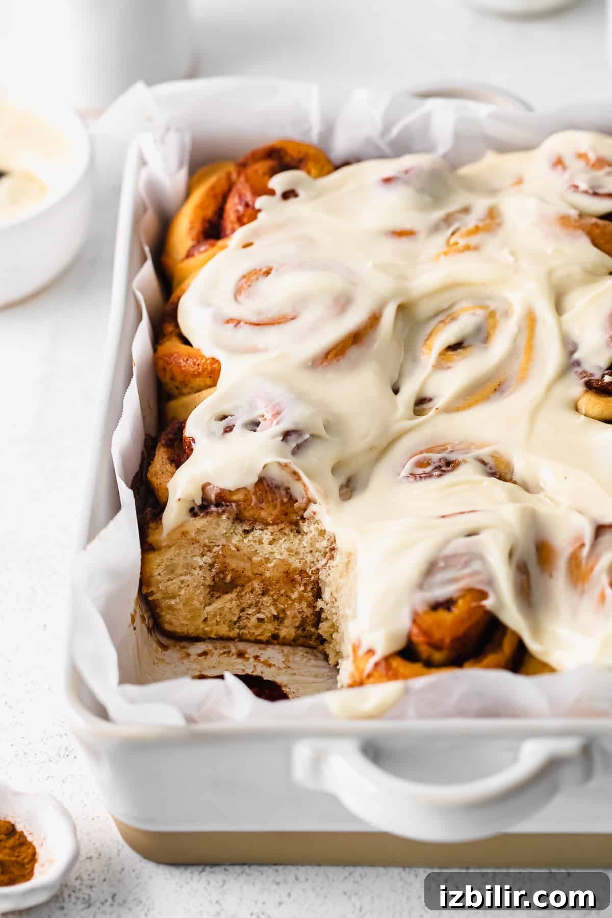 maple cinnamon rolls topped with cream cheese frosting