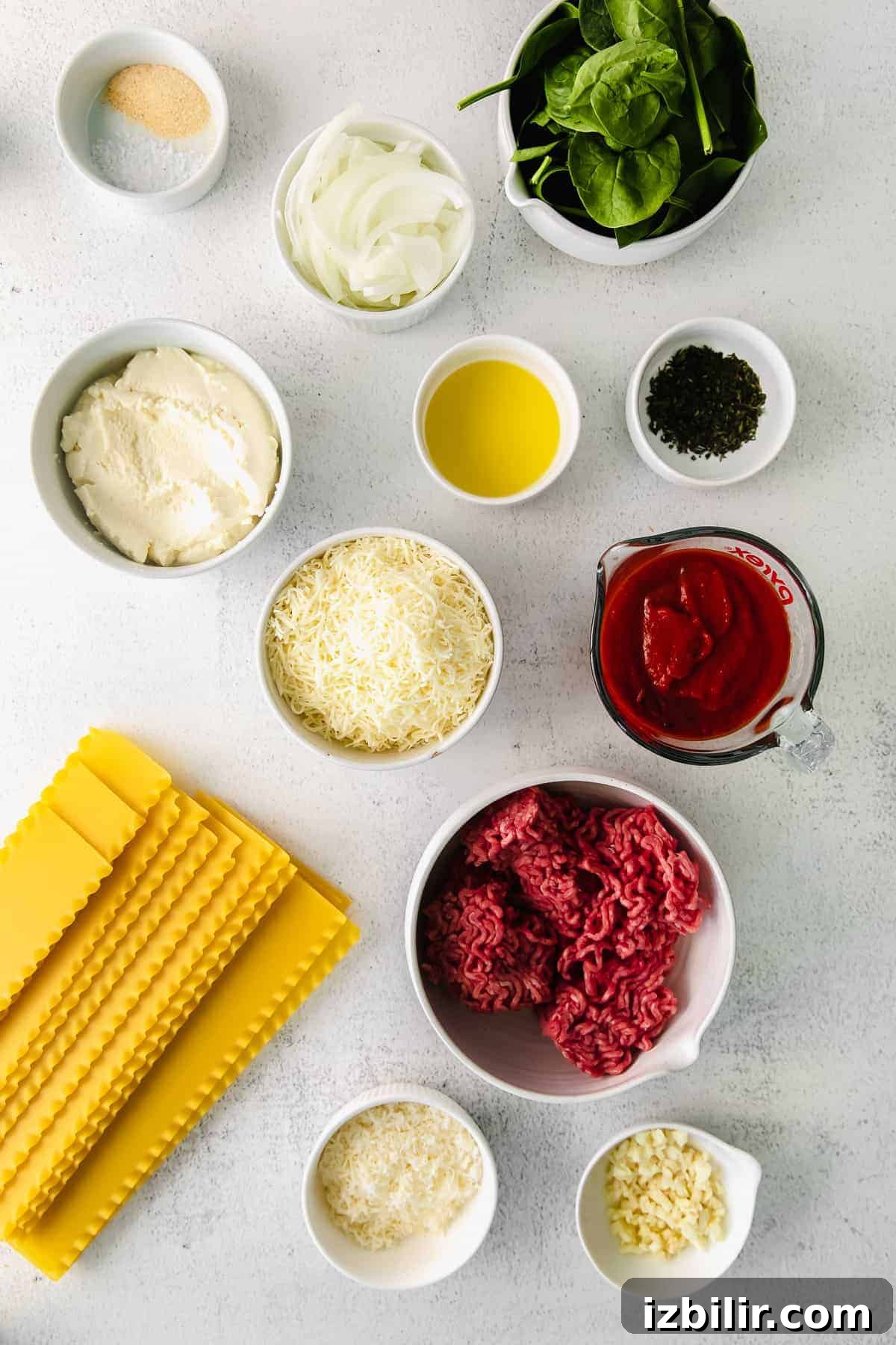 Classic Lasagna Roll-Ups Recipe 3 All of the ingredients for lasagna roll ups on the kitchen counter.