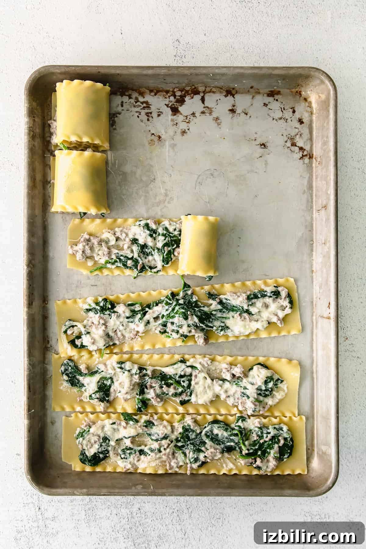 Classic Lasagna Roll-Ups Recipe 6 Lasagna noodles on a baking sheet.