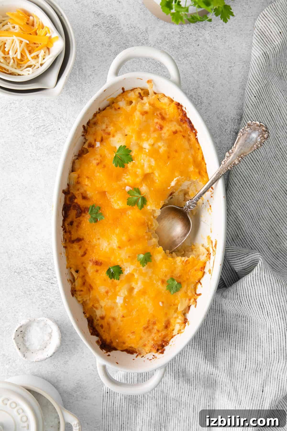 Potato Casserole is a midwestern holiday staple cheesy potato casserole in dish