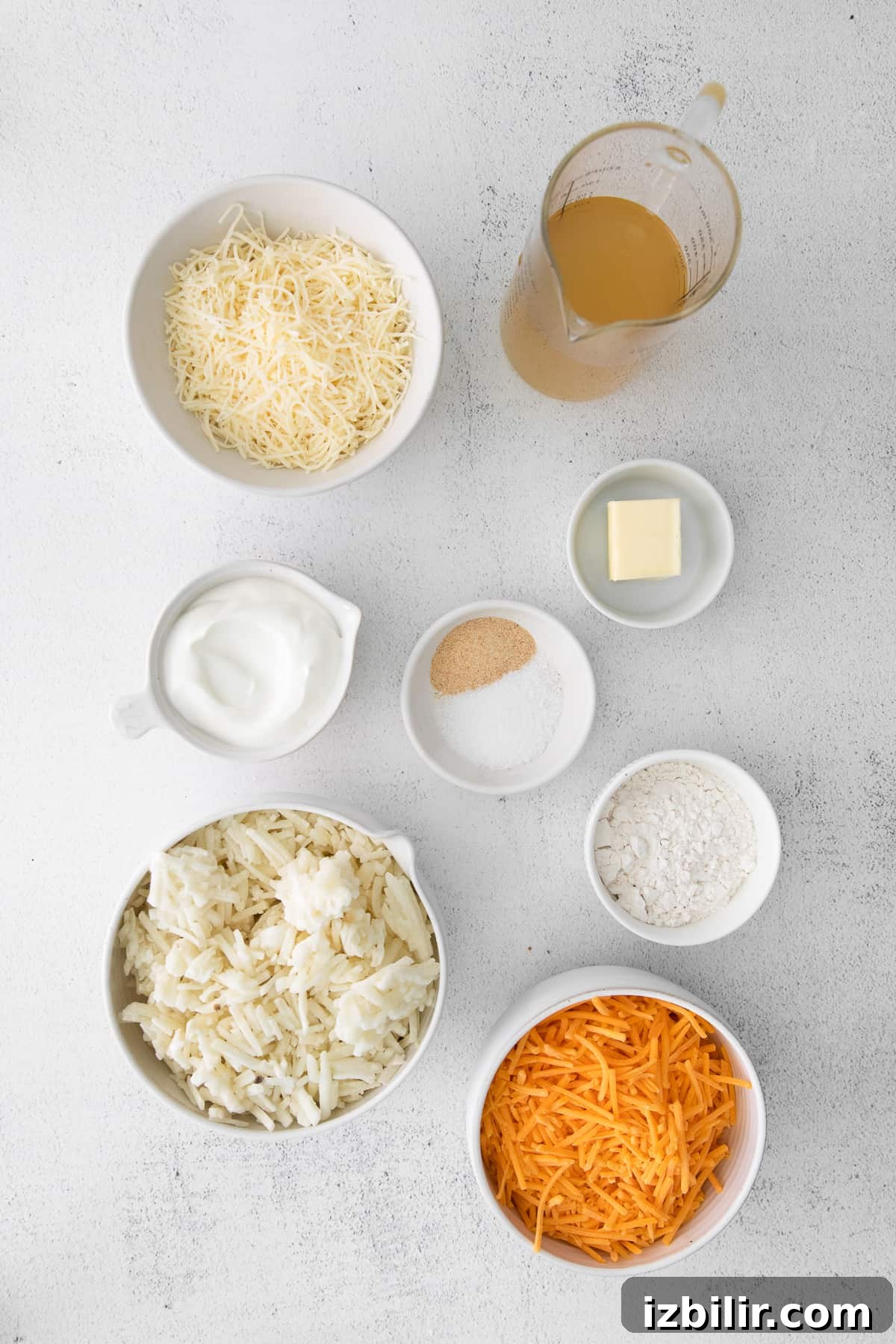 Ingredients laid out for cheesy potato casserole ingredients on counter