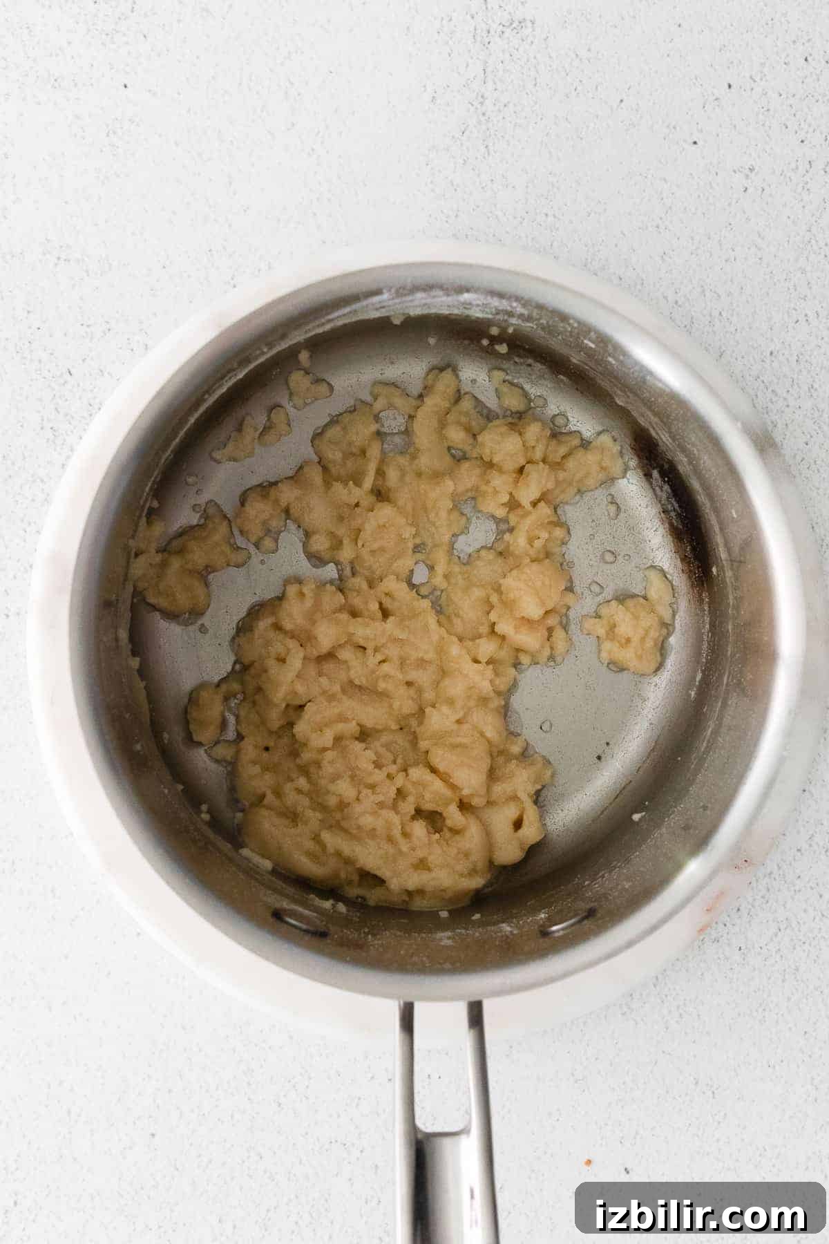 Making the roux for the cheese sauce flour and butter in pot