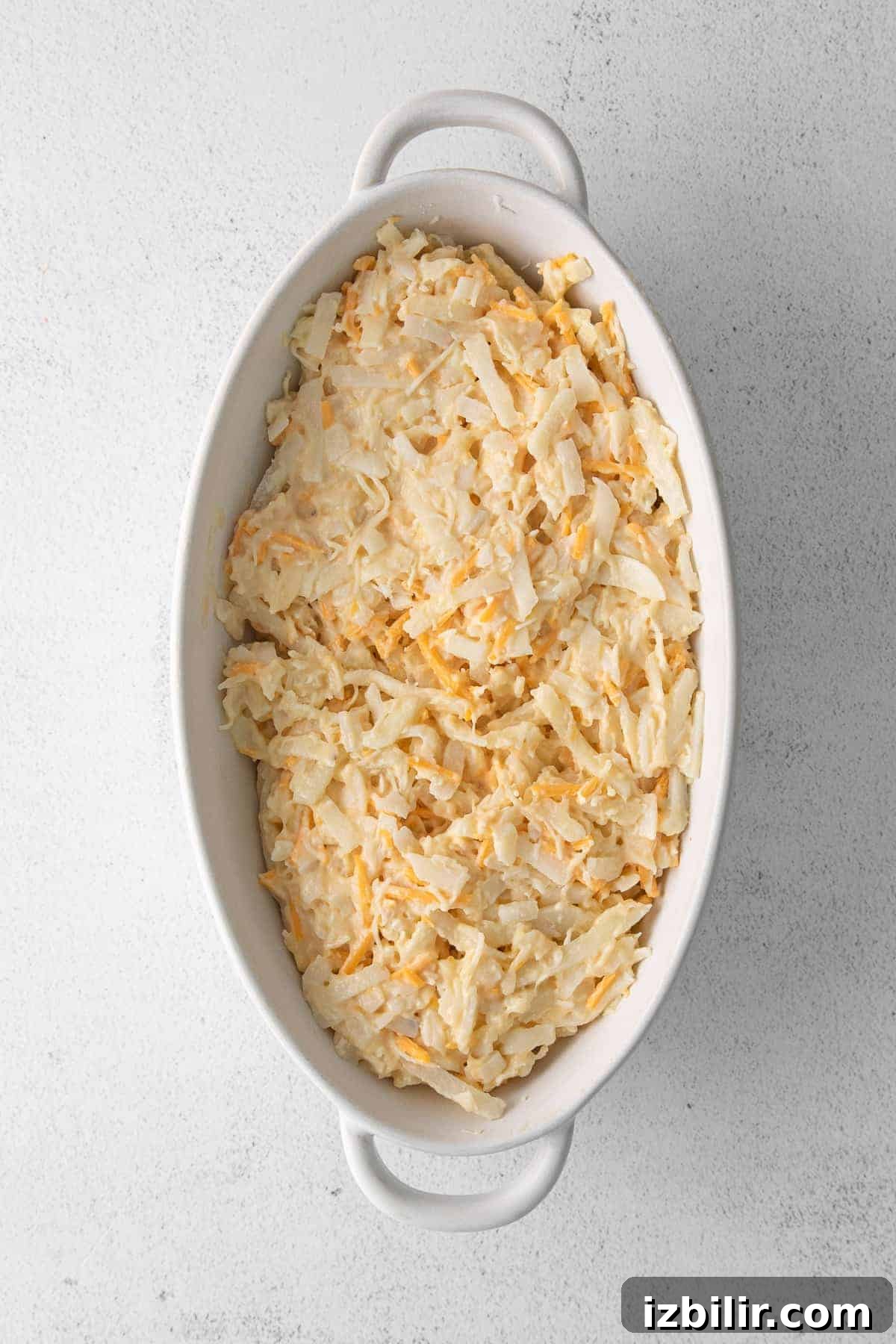 Baked cheesy potato casserole ready to serve cheesy potato casserole in dish