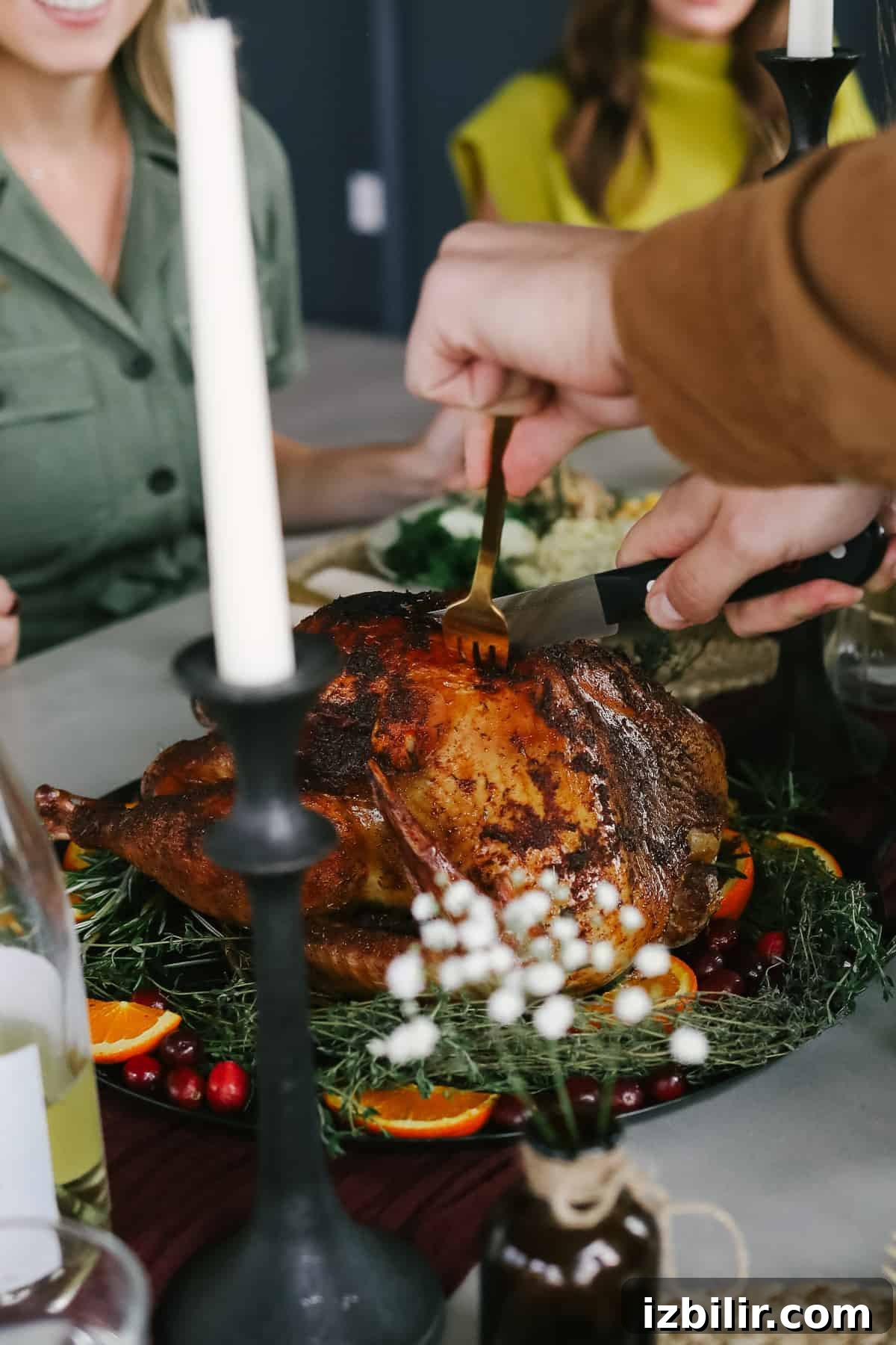 Thanksgiving Menu 2021: Your Complete Holiday Recipe Guide 4 man carving a turkey at a thanksgiving table