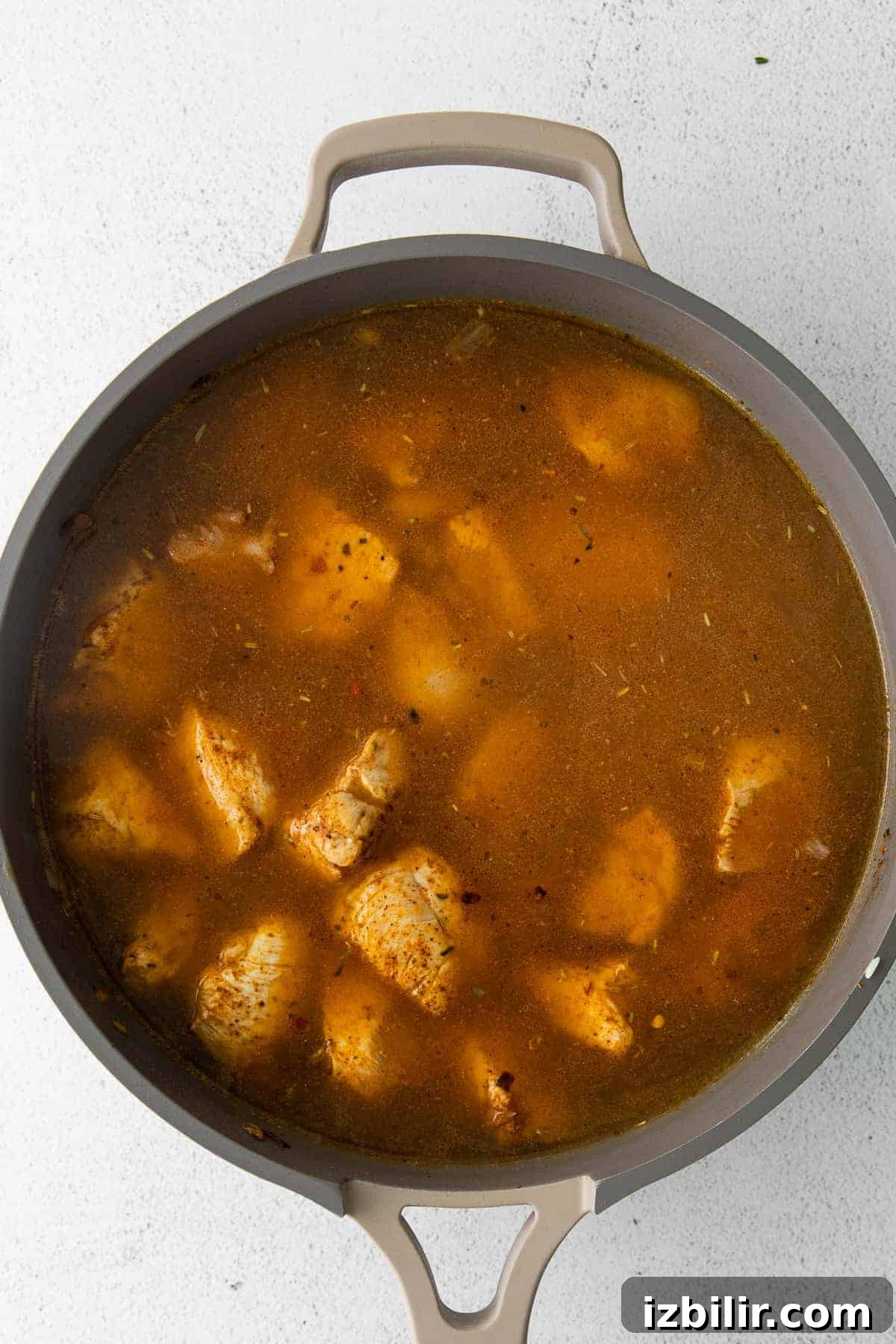 chicken cooking in skillet