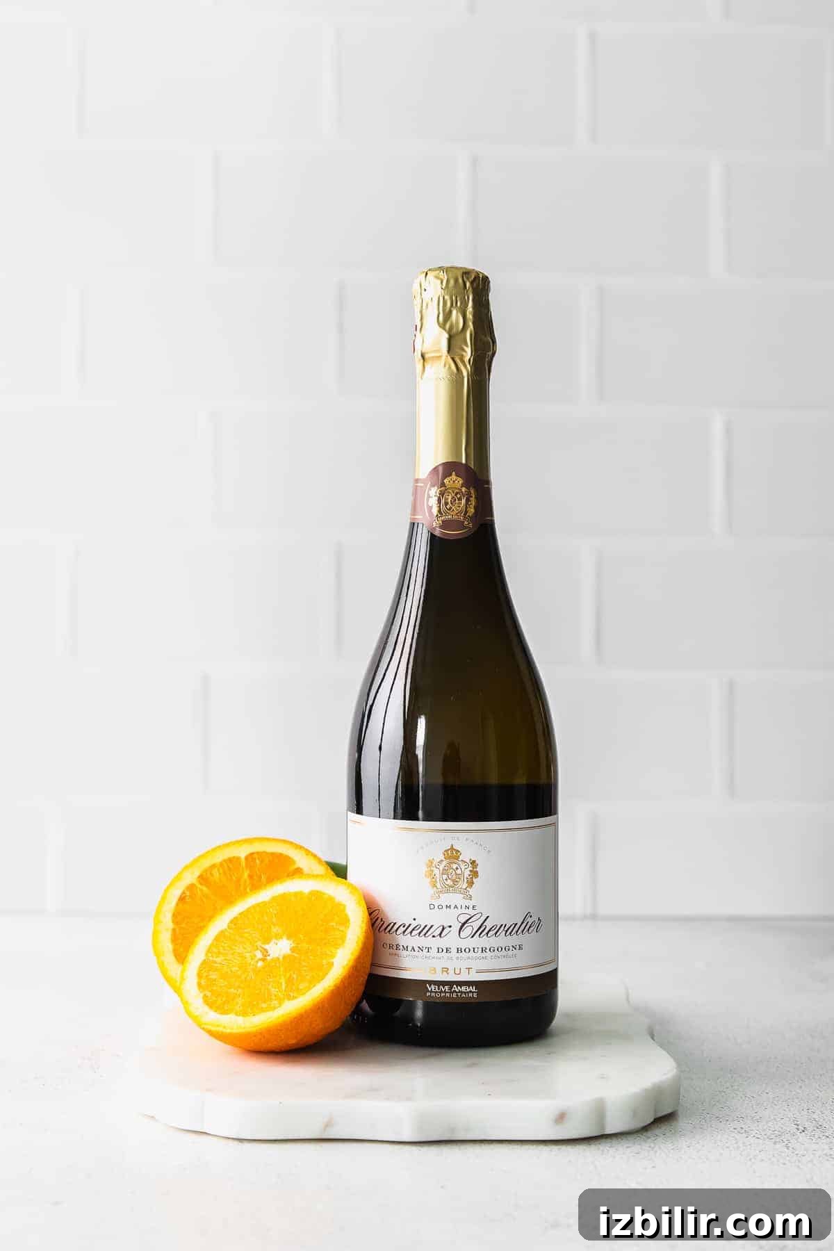 Champagne and oranges a bottle of champagne with orange slices next to it