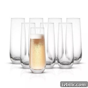 Classic Champagne Mimosa Recipe for Brunch 2 champagne flutes on clear background.