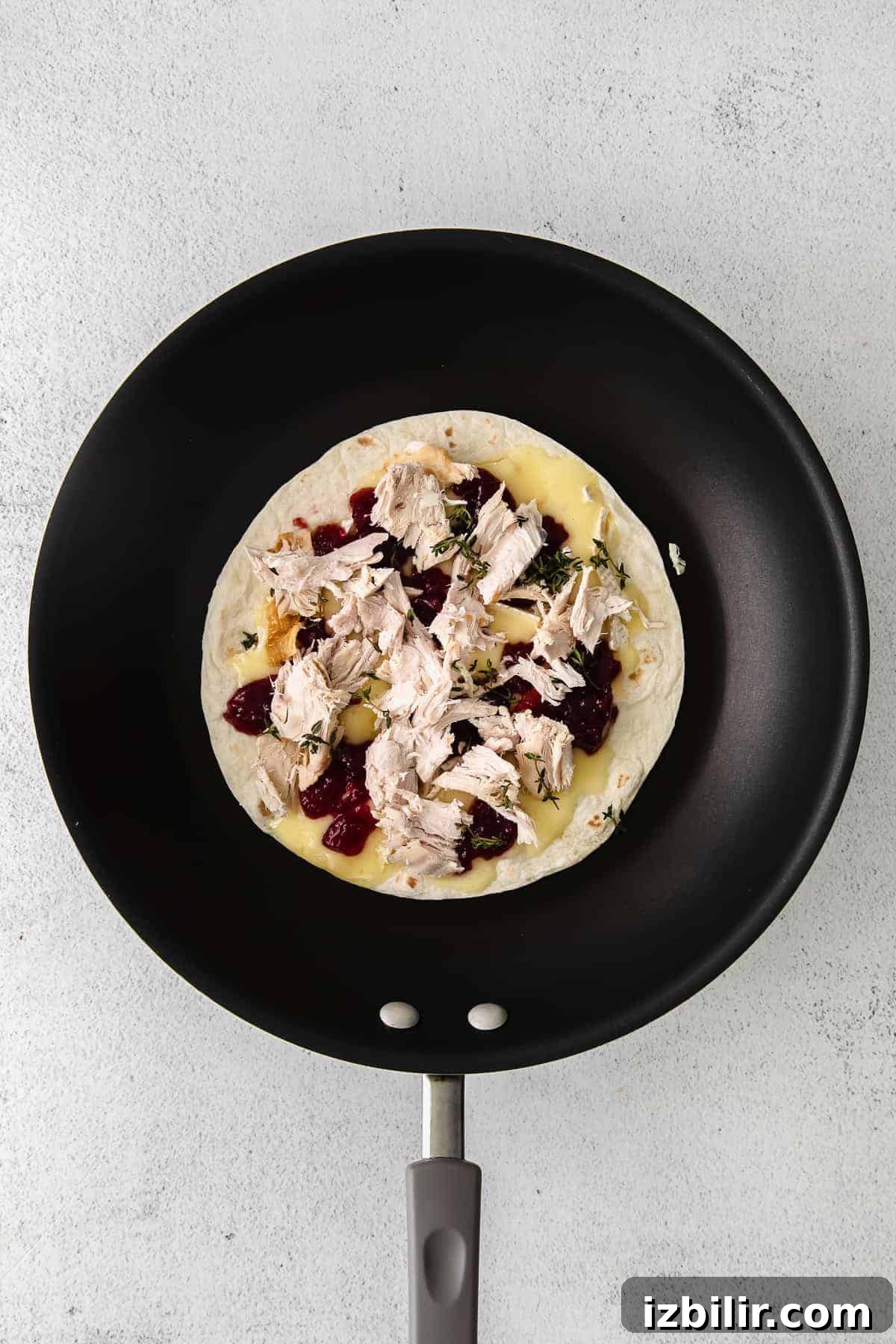 Leftover Thanksgiving Turkey Quesadilla with Cranberry Salsa 4 Leftover Thanksgiving turkey quesadilla in a skillet