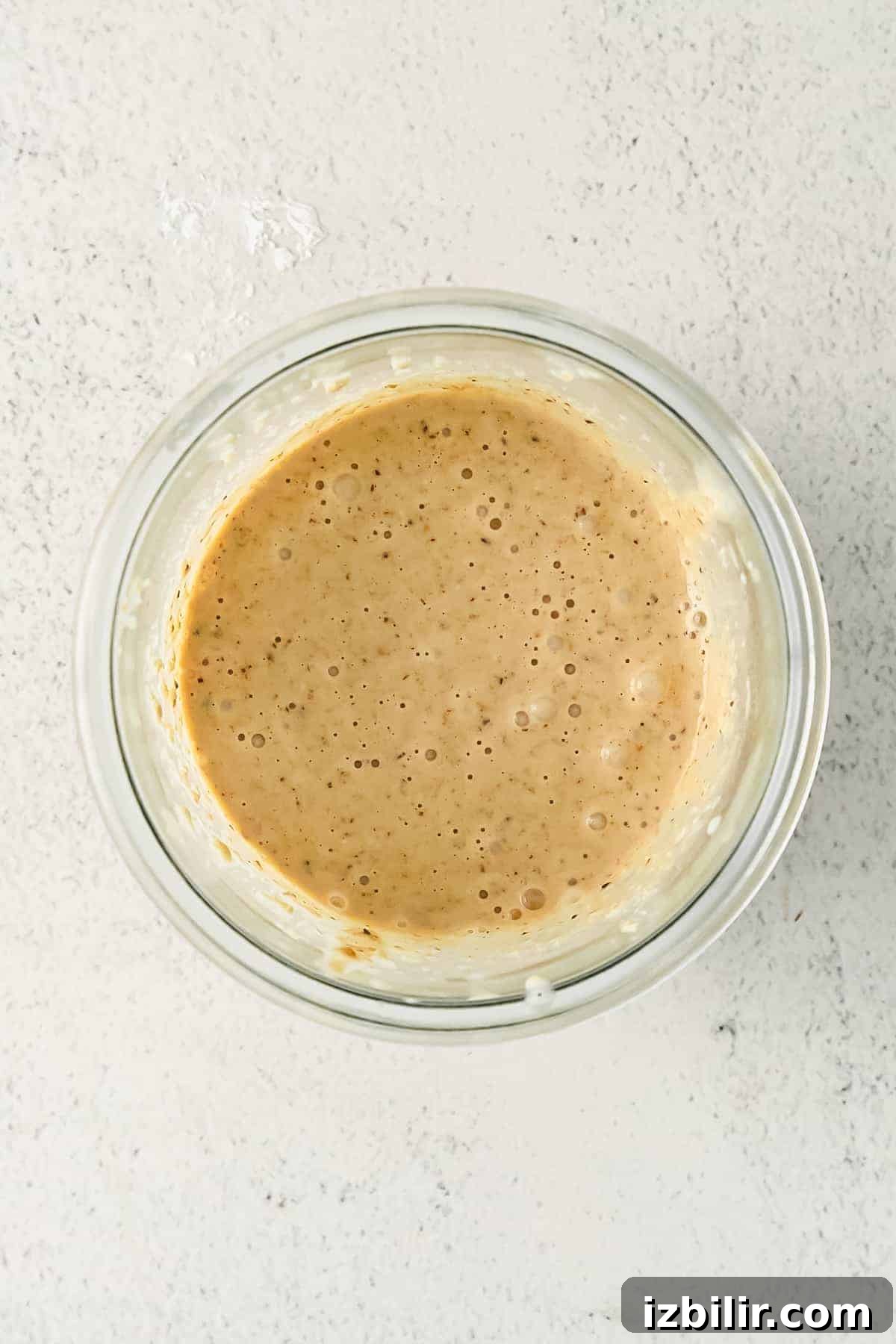 Blended batter. blended baked oatmeal ingredients blended together in a glass.