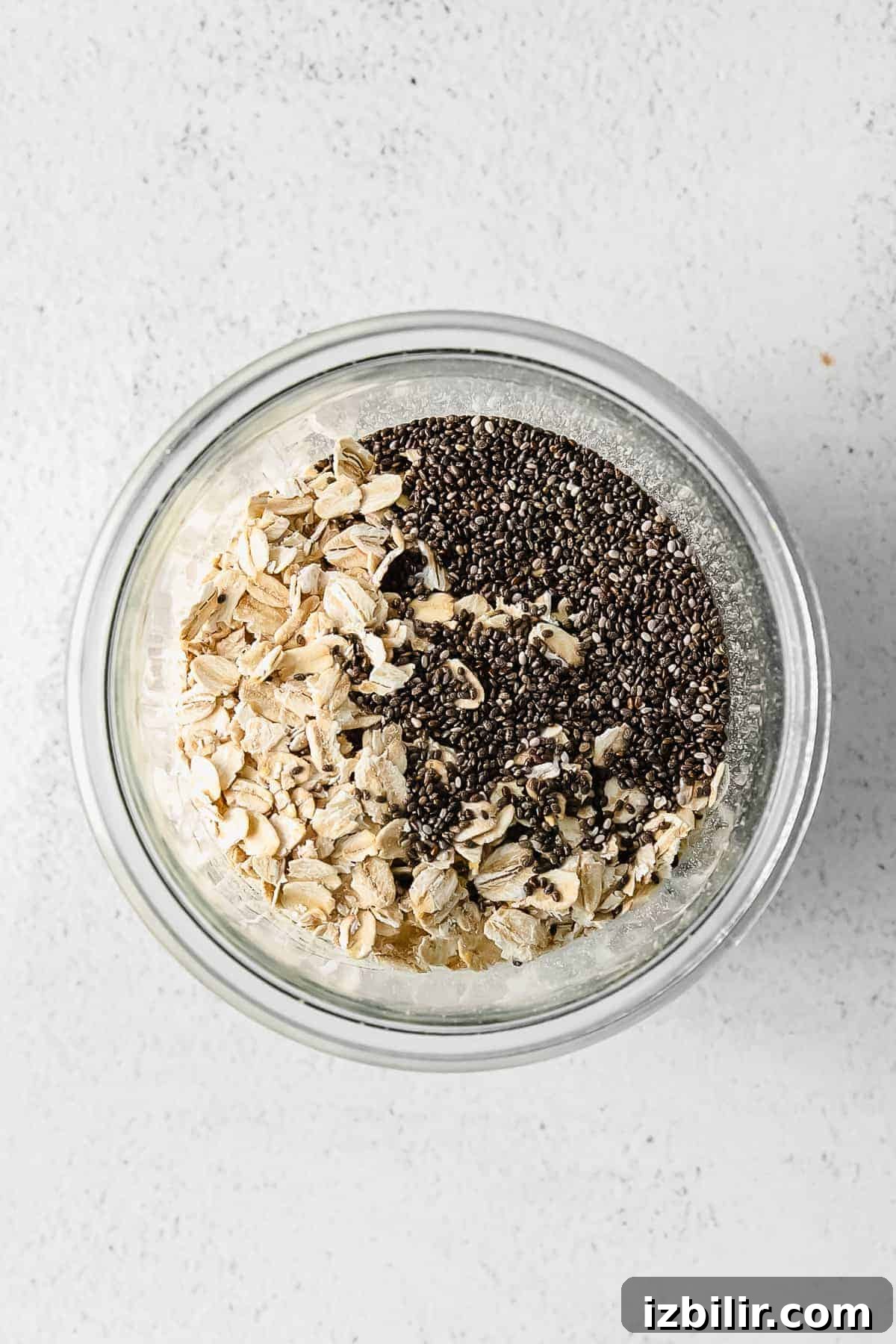 brown sugar shaken espresso overnight oats mixed together in a glass jar ready to refrigerate