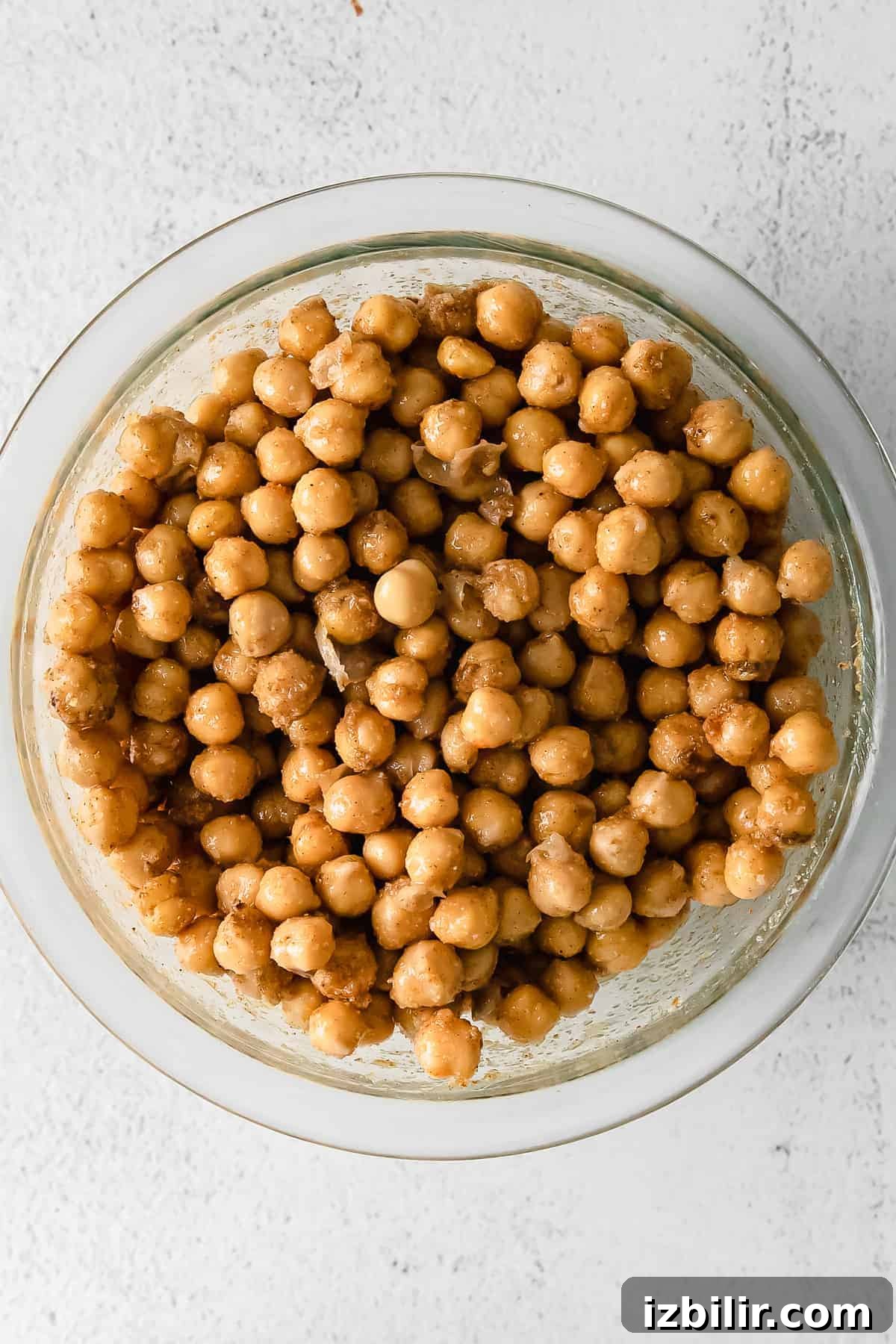 One-Pot Yellow Rice with Marinated Chickpeas Recipe 4 Chickpeas marinating in a bowl.