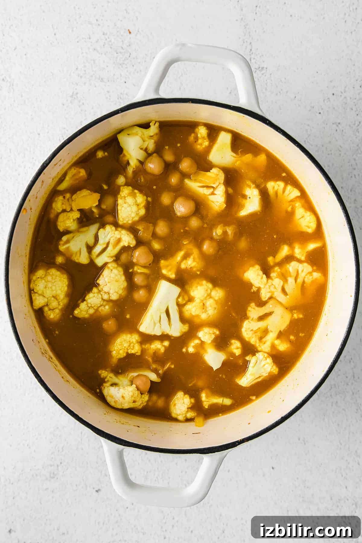 One-Pot Yellow Rice with Marinated Chickpeas Recipe 5 All the ingredients for this yellow rice recipe in a dutch oven.