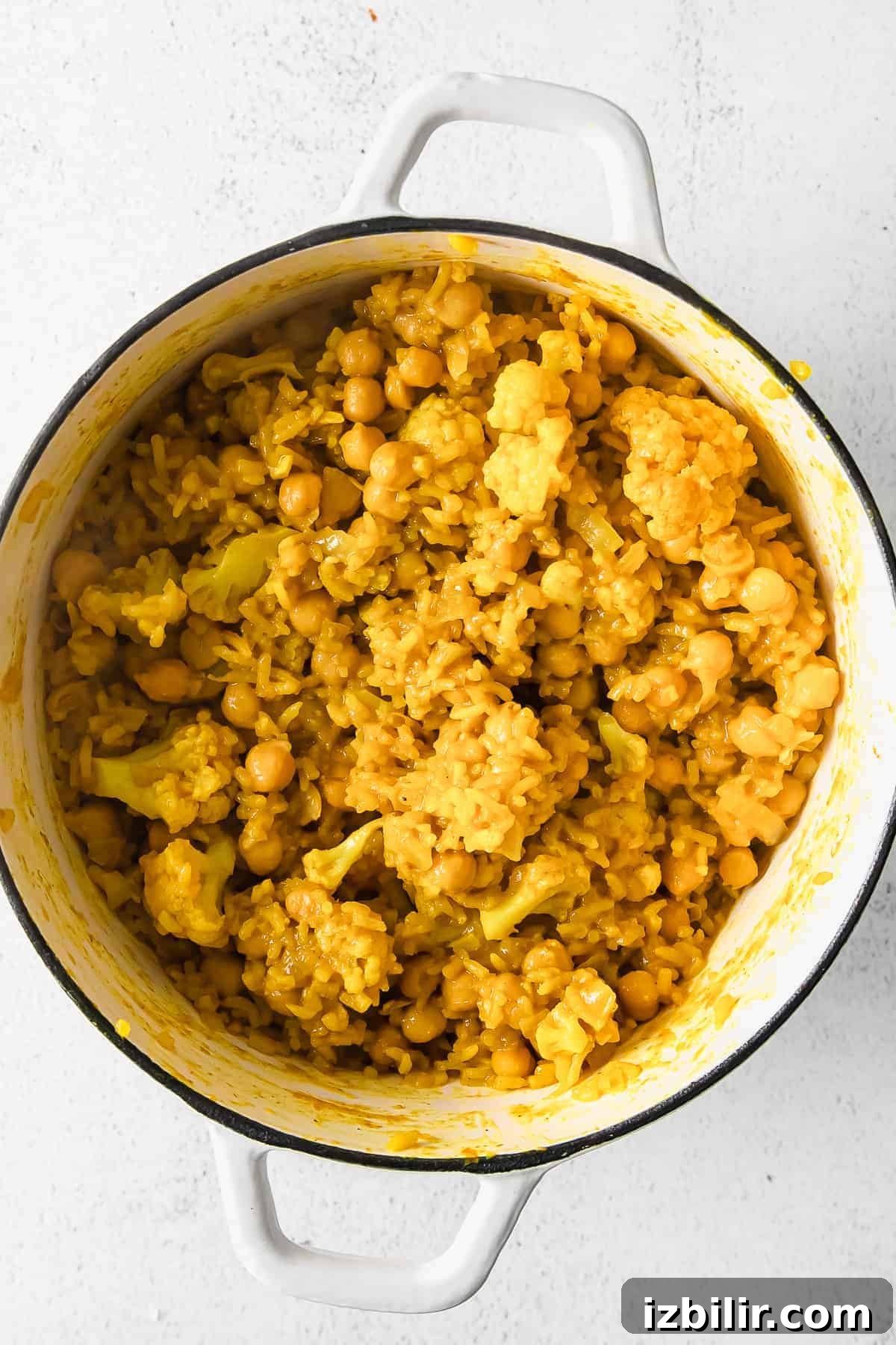 One-Pot Yellow Rice with Marinated Chickpeas Recipe 6 Cooked rice, beans, and cauliflower.