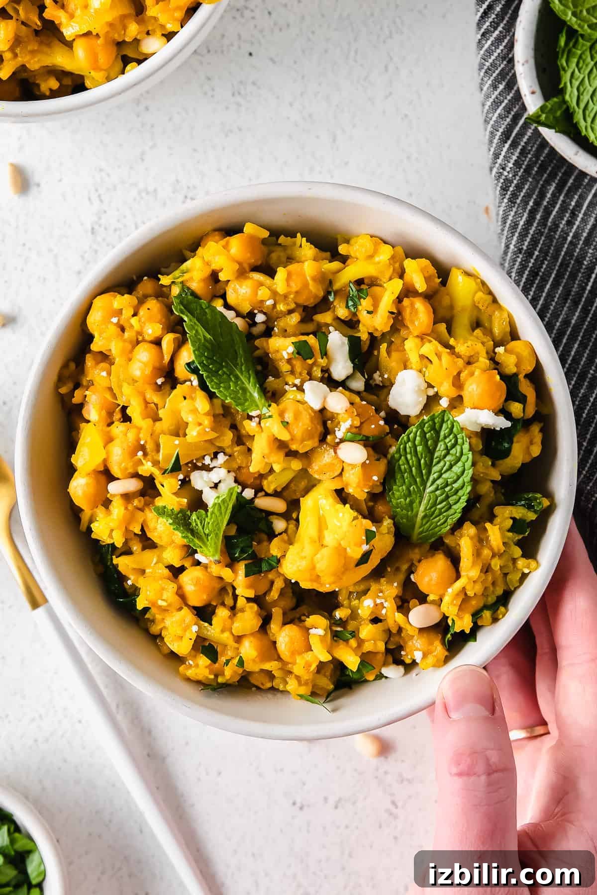 One-Pot Yellow Rice with Marinated Chickpeas Recipe 8 A bowl of yellow rice.