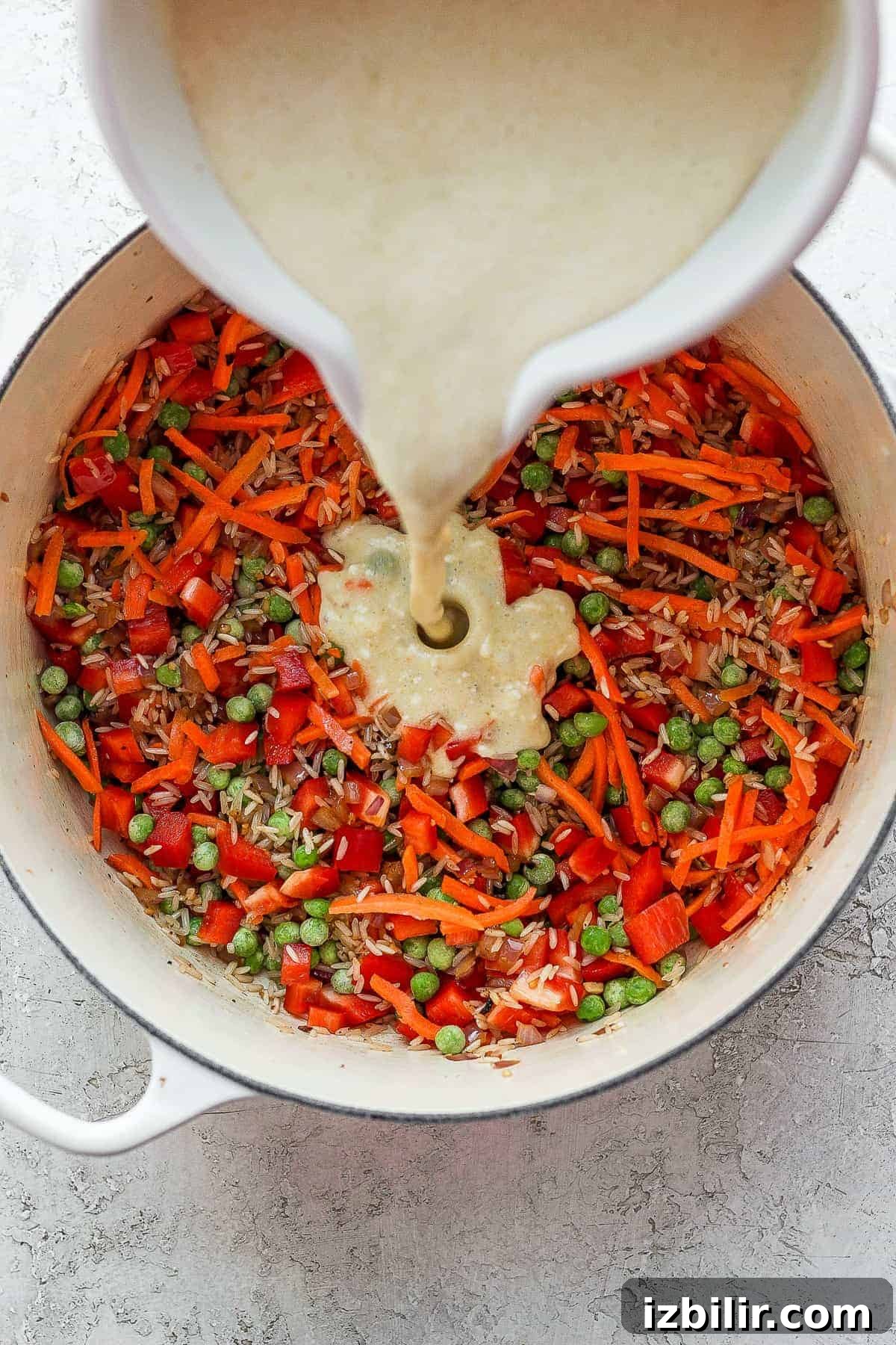 Pouring curry sauce over veggies pouring curry sauce over veggies
