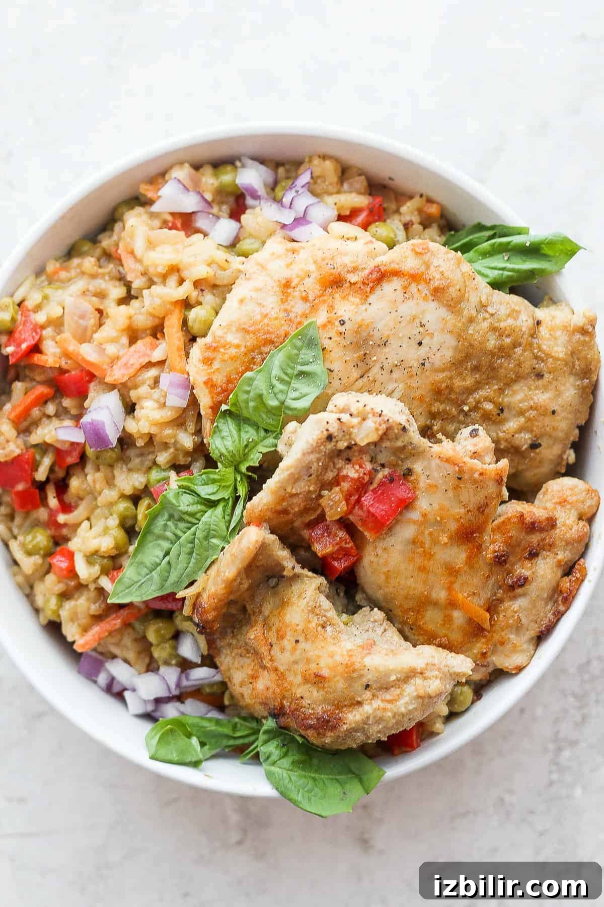 One Pot Curry Chicken and Rice chicken and rice on plate