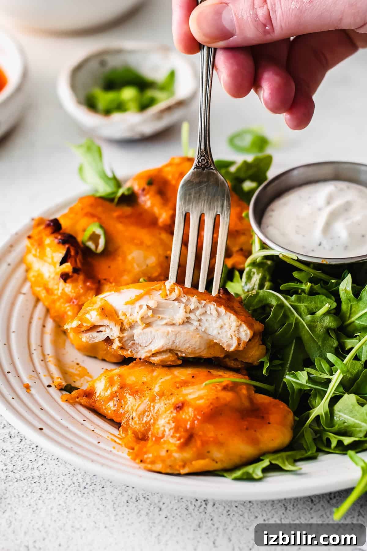 boneless chicken thigh on a fork