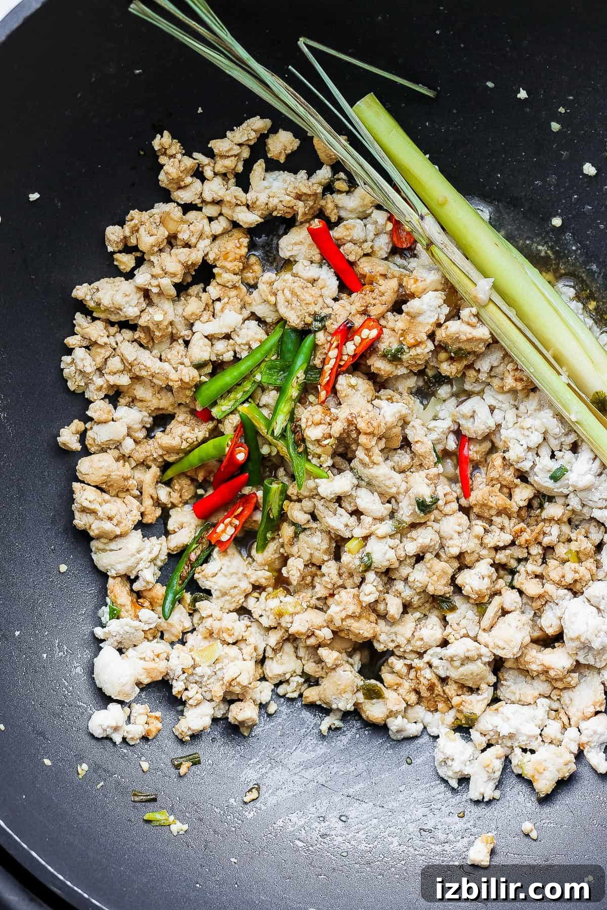 cooked chicken with chili peppers in wok