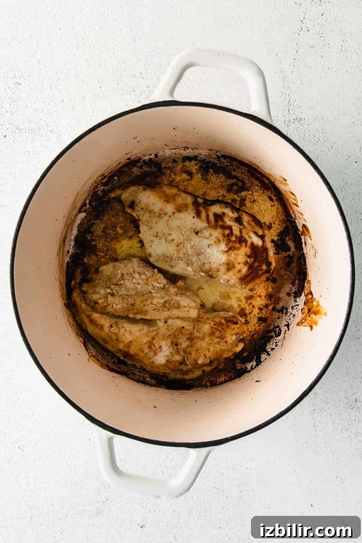 Chicken thighs in a dutch oven.
