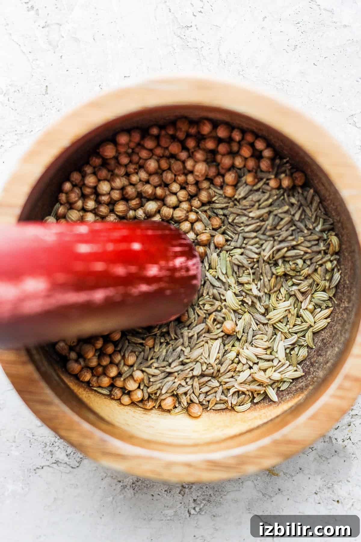 Za'atar ingredients in a mortar and pestle za'atar seasoning ingredients in a mortar and pestle