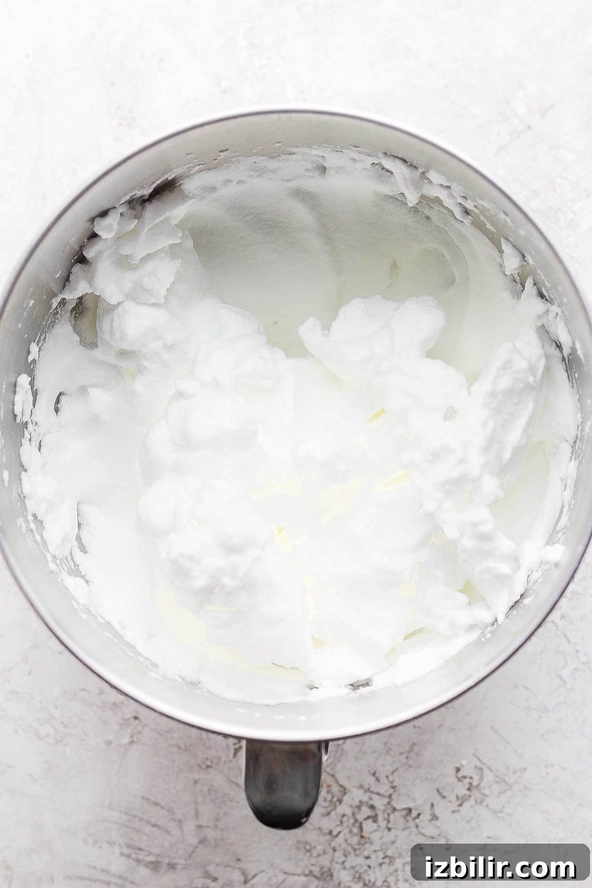 Egg whites whipped to stiff peaks egg whites in a mixing bowl