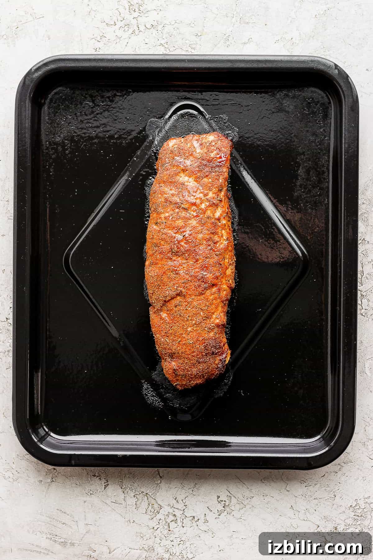 Crispy Air Fryer Pork Tenderloin with Garlic Herb Rub 5 air fryer pork tenderloin on the air fryer sheet