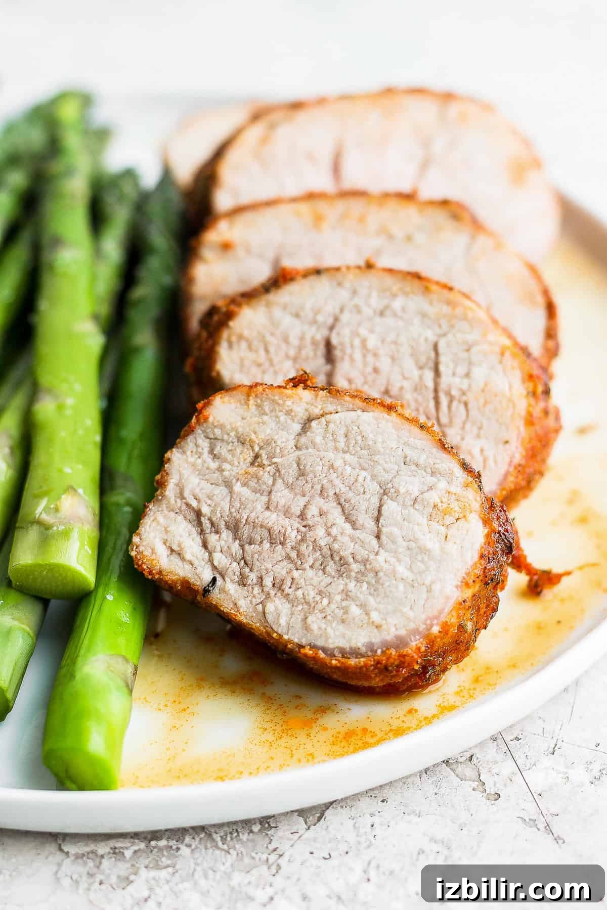 Crispy Air Fryer Pork Tenderloin with Garlic Herb Rub 8 air fryer pork tenderloin sliced on a plate