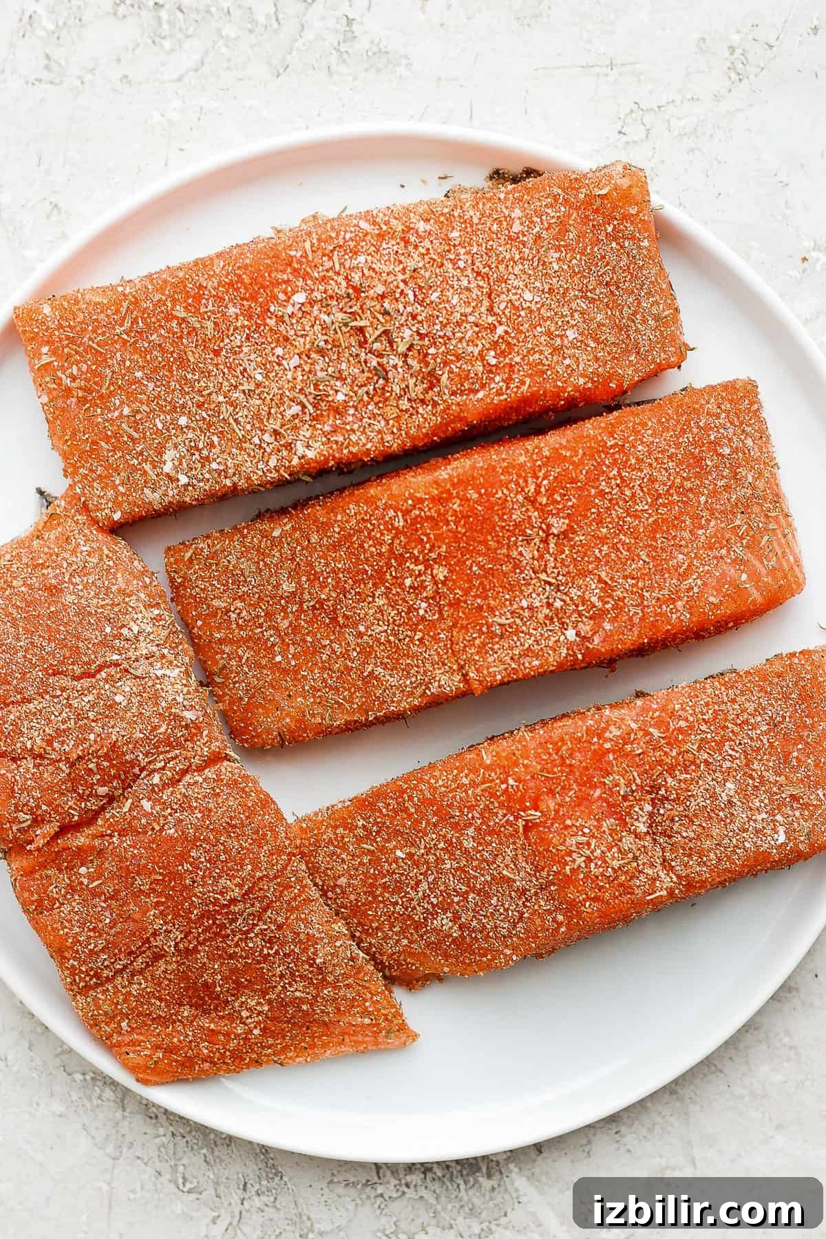 Zesty Salmon Seasoning Recipe for Grilling and Baking 4 salmon filets with salmon seasoning on a plate