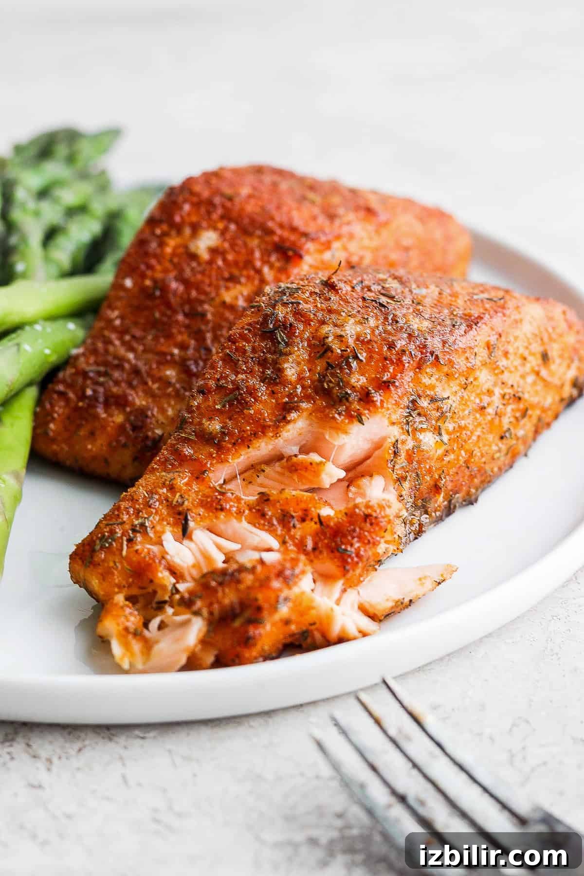 Perfectly flaky air fryer salmon Flaky cooked salmon on a plate